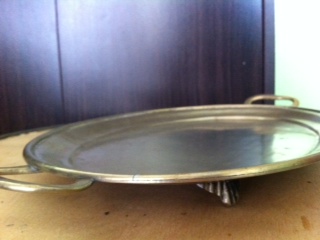 Brass tray with handle.